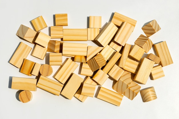 Wooden building blocks on white surface