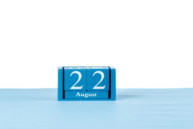 Wooden calendar August 22 on a white background