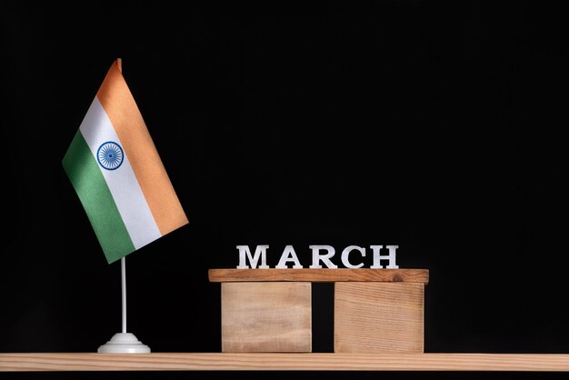 Wooden calendar of March with Indian flag on black