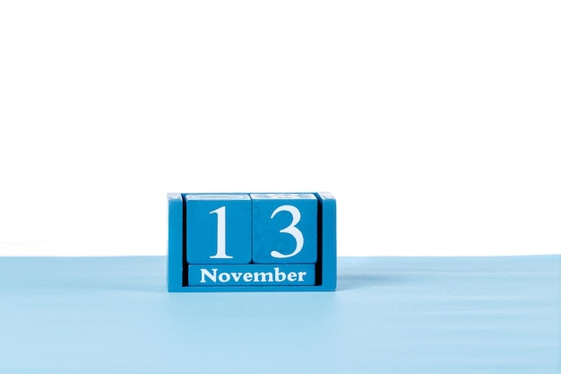 Wooden calendar November 13 on a white background