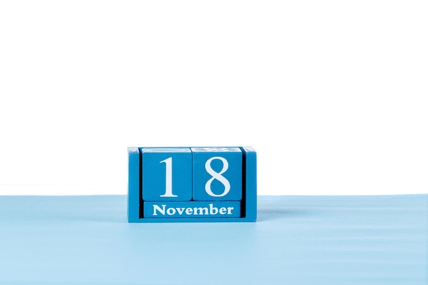 Wooden calendar November 18 on a white background