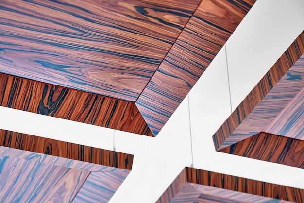 Wooden ceiling panels Rosewood fineline veneer ceiling panels in the modern office Closeup