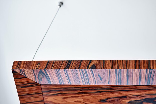 Wooden ceiling panels Rosewood fineline veneer ceiling panels in the modern office Closeup