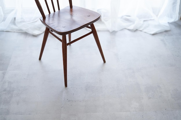 Wooden chair by the window