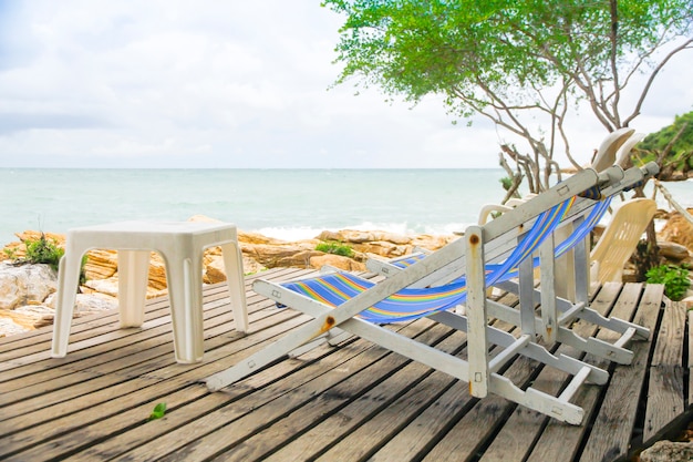 Photo wooden chair on landscape stage with beautiful beach