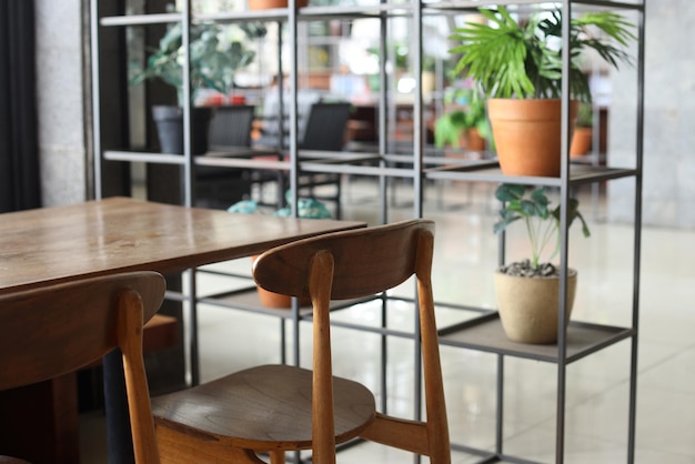 Wooden chairs and table in cafeteria.