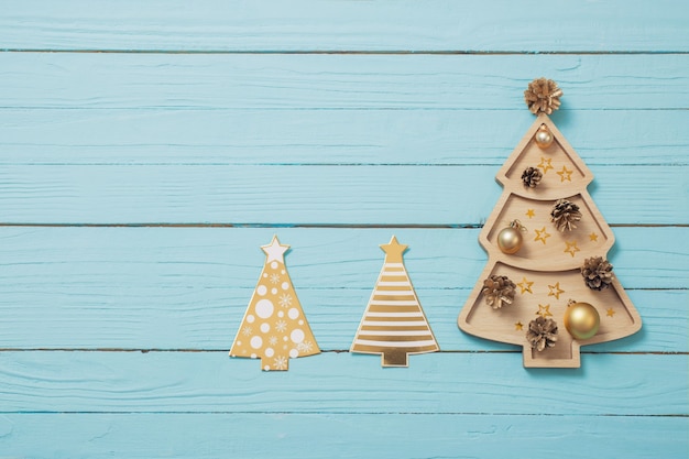 Wooden christmas tree on blue wooden table