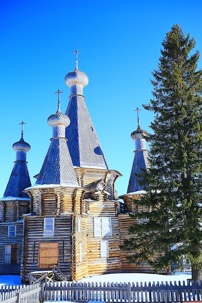 wooden church in the Russian north landscape in winter, architecture historical religion Christianity