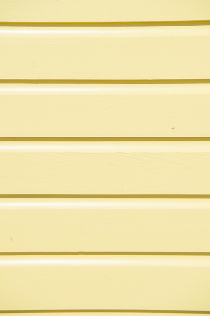 Wooden clapboard background of textured siding painted in orange color with horizontal lines and nobody as empty or blank backdrop