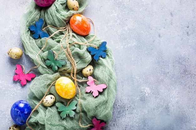 Wooden colored butterflies with easter eggs