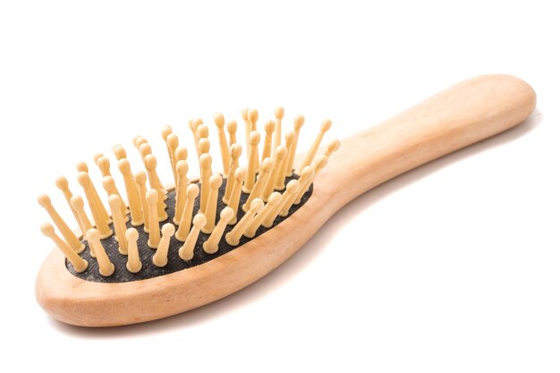 Wooden comb on a white background.