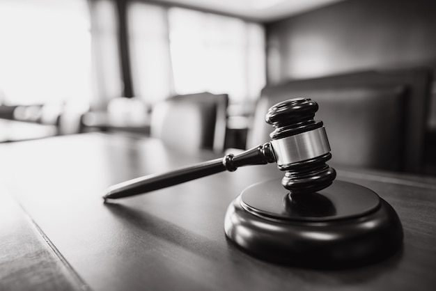 Wooden court gavel on wood table in courtroom,judge and trial. Auction. Law and Justice, Legality concept, Judge.