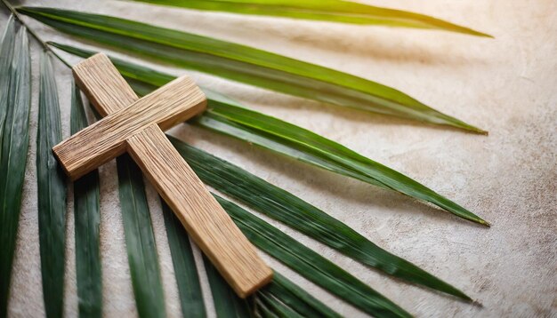 Photo wooden cross and palm leaves rest on a neutral blurred background symbolizing palm sundays celebr