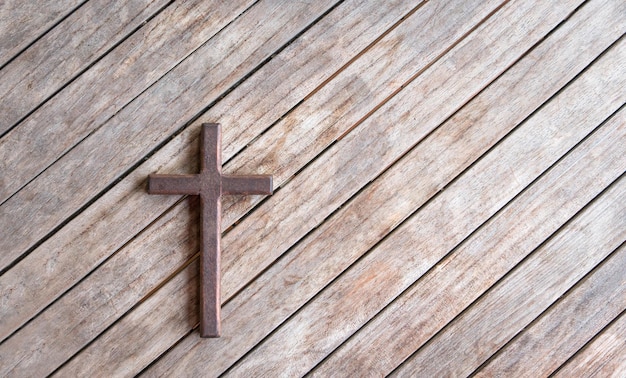 Wooden cross on top of wood table