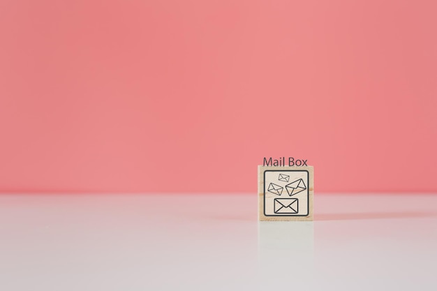 Wooden cube blocks with letter icon and mailbox word contact mail message online logistic concept