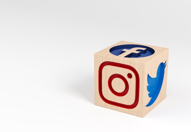 wooden cube with carved social media icons