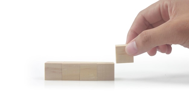 Wooden cubes in hand with copy space for input wording