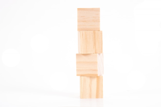  wooden cubes on white table and.