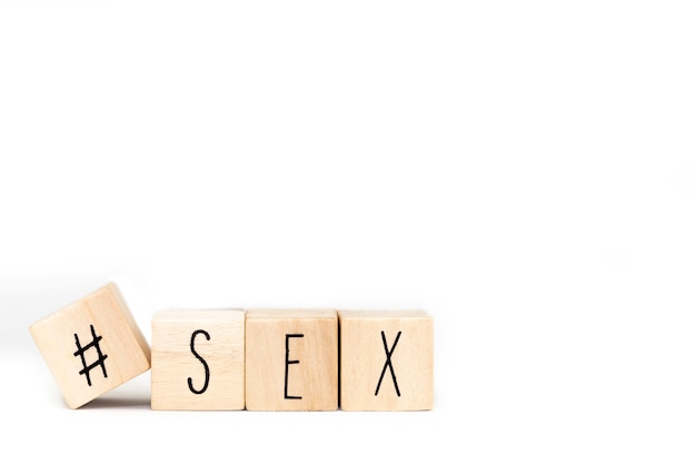 Wooden cubes with a Hashtag and the word Sex isolated, social media concept