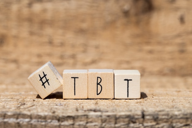 Wooden cubes with a hashtag and the word TBT, Throw back to, social media concept