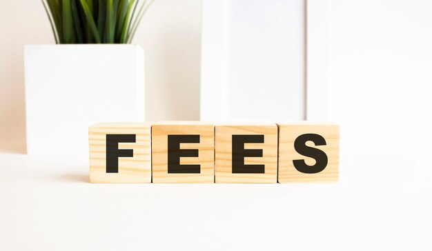 Wooden cubes with letters on a white table