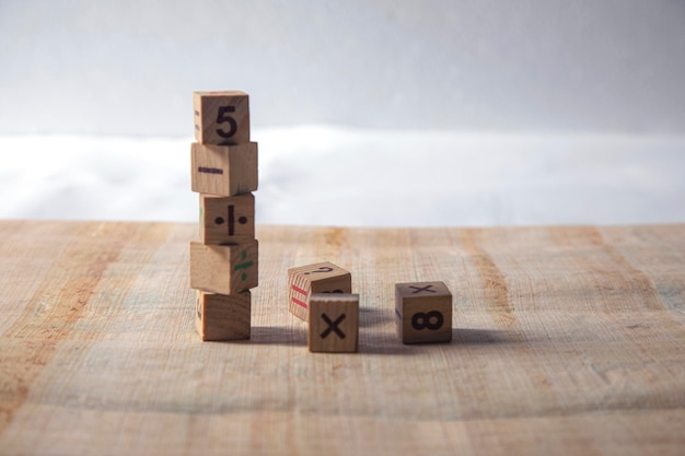 a wooden cubes with numbers on a table