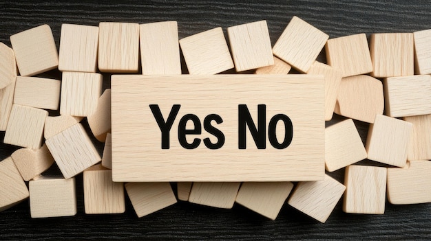 Wooden cubes with the words yes and no are arranged amidst a wooden background reflecting choices and decisions The top view emphasizes the natural texture of the surface