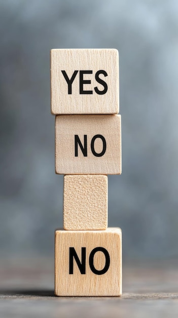 Wooden cubes with the words yes and no are arranged amidst a wooden background reflecting choices and decisions The top view emphasizes the natural texture of the surface