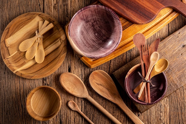 Wooden cutlery on wooden table