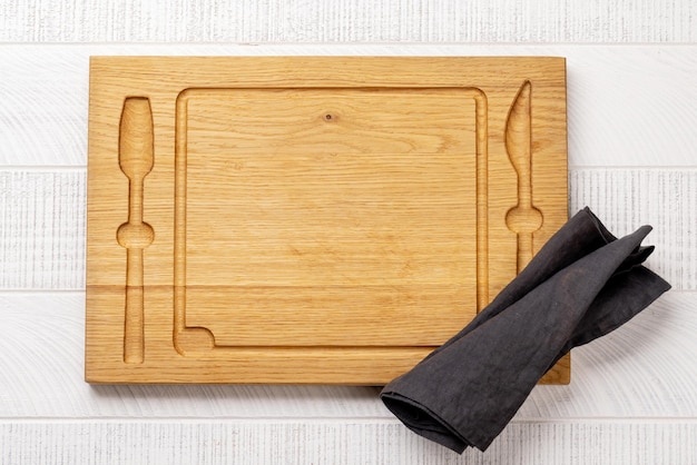 Wooden cutting board and kitchen towel