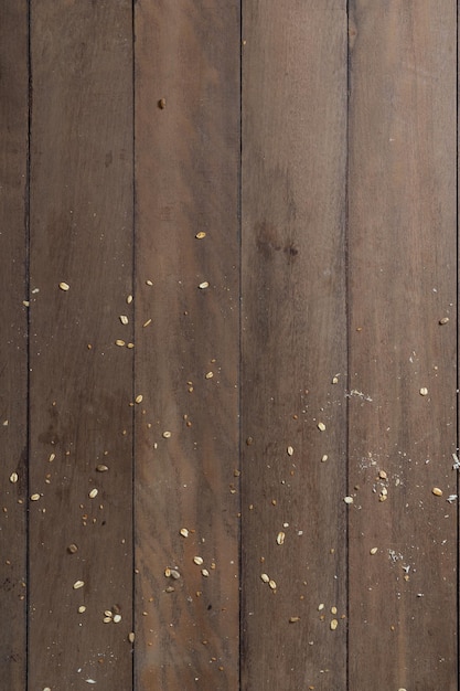 A wooden desk full of bread bran