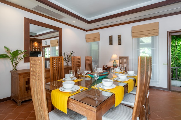 Wooden dining table and counter bar in kitchen