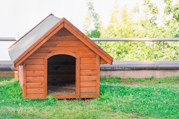 Wooden dog house on the lawn