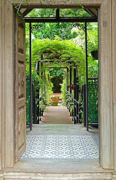 Wooden Door Opens to the Tropical Garden