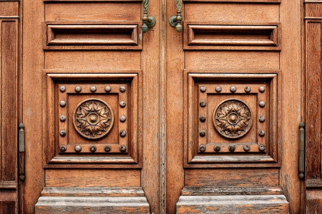 Wooden door with ancient floral patten. Wood carving technic.