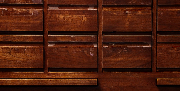 A wooden drawer with the word " on it " on the bottom.