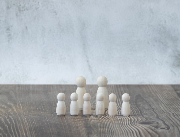 Wooden figures representing a large family