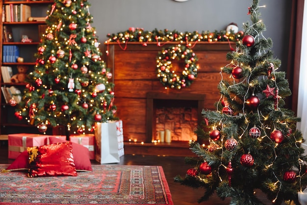 Wooden Fireplace is Decorated Christmas Tree with Red Toys in Front and Background