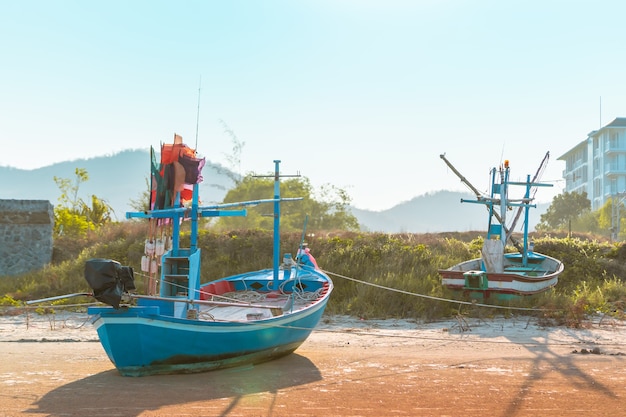 wooden Fishing boat on an island sand beach