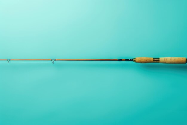 A Wooden Fishing Rod Awaits the Catch on a Turquoise Background