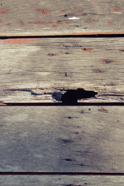 Wooden floor is made of old wooden boards with beautiful patterns