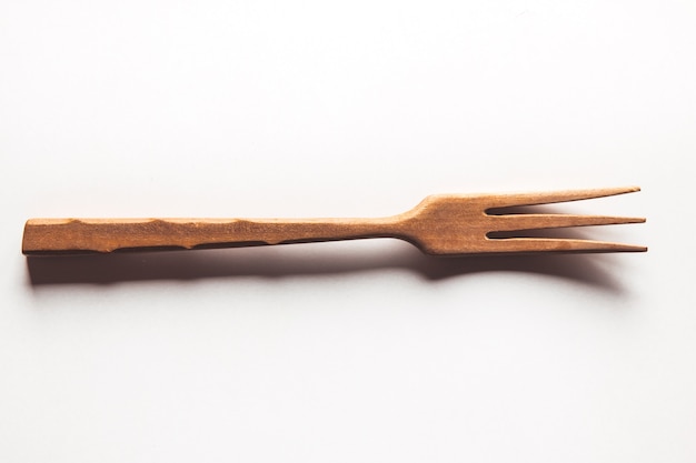 Photo wooden fork on white background