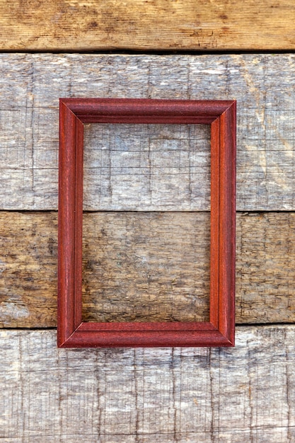 Wooden frame on wooden background