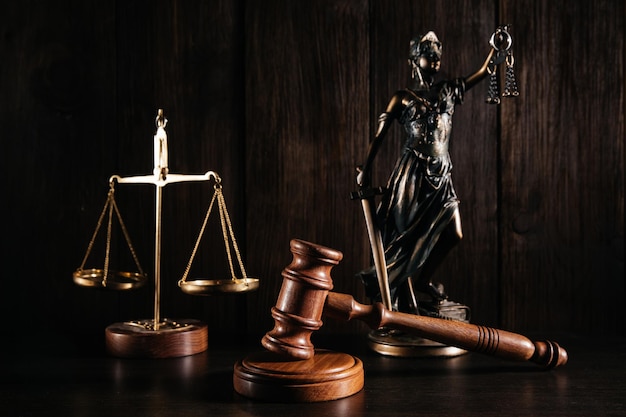 Wooden gavel scales and lady of justice