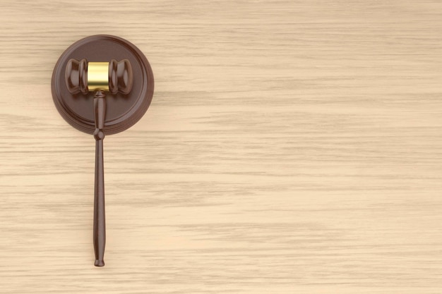 Photo wooden gavel on the wooden desk