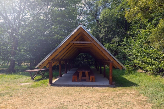 Wooden gazebo or pavilion in the forest open air