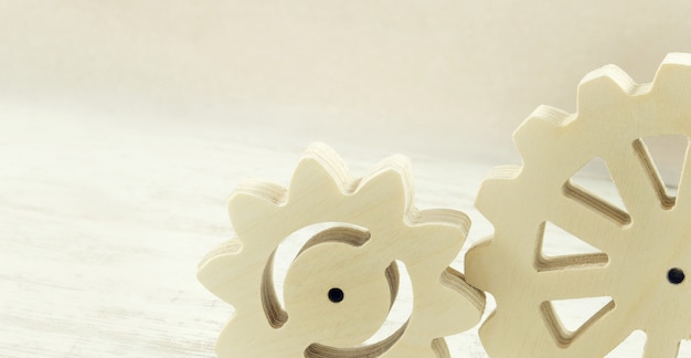 Wooden gear mechanism on a white background