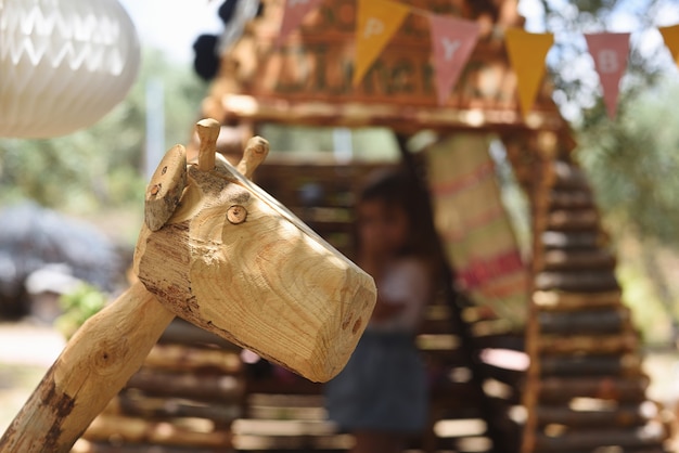 Wooden giraffe in childrens playground