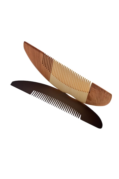 Wooden hair comb Isolated on a white background with black shadow Trendy catalogue shot