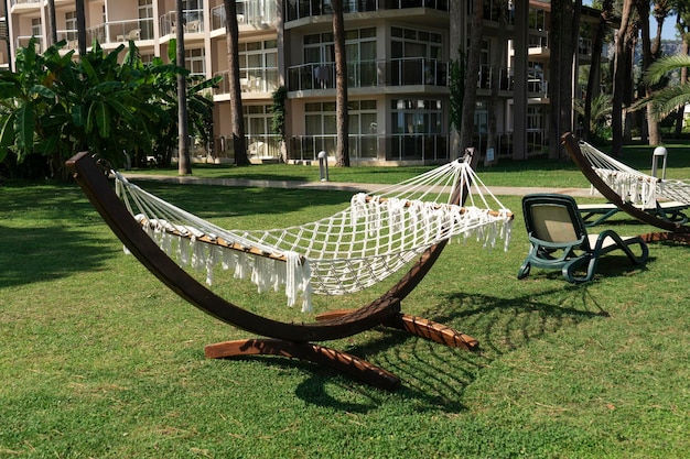 A wooden hammock standing in the center of the garden